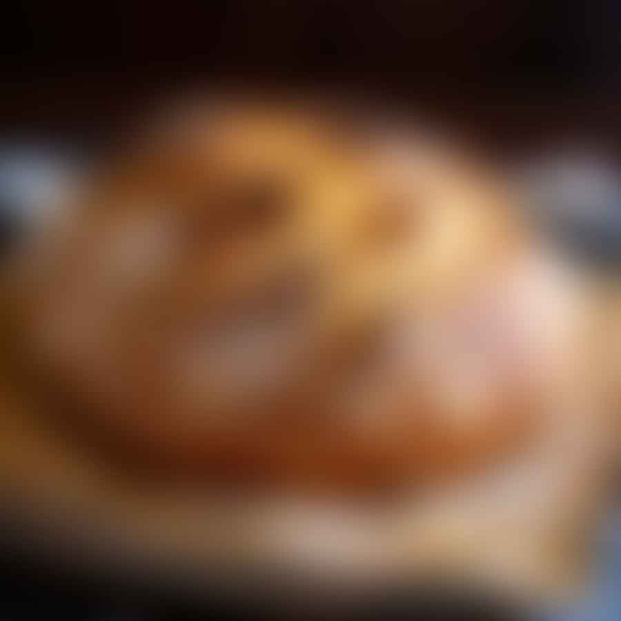 A rustic loaf of sourdough bread with a golden crust